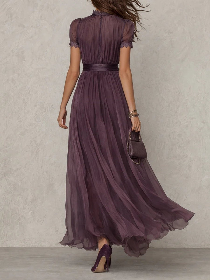 back view of pleated purple chiffon maxi dress with high lace collar