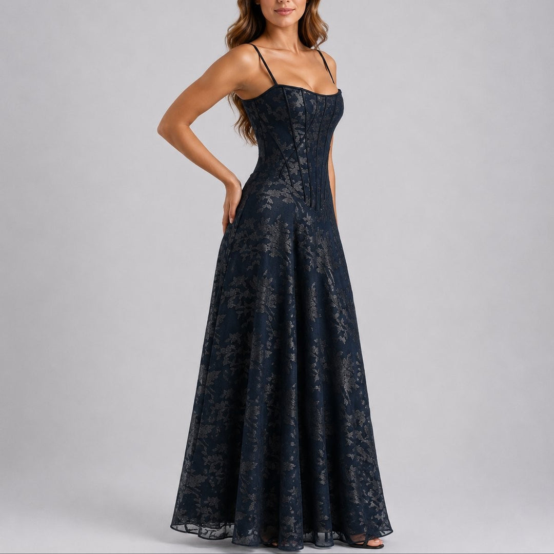Navy floral corset maxi dress styled with strappy heels, side angle