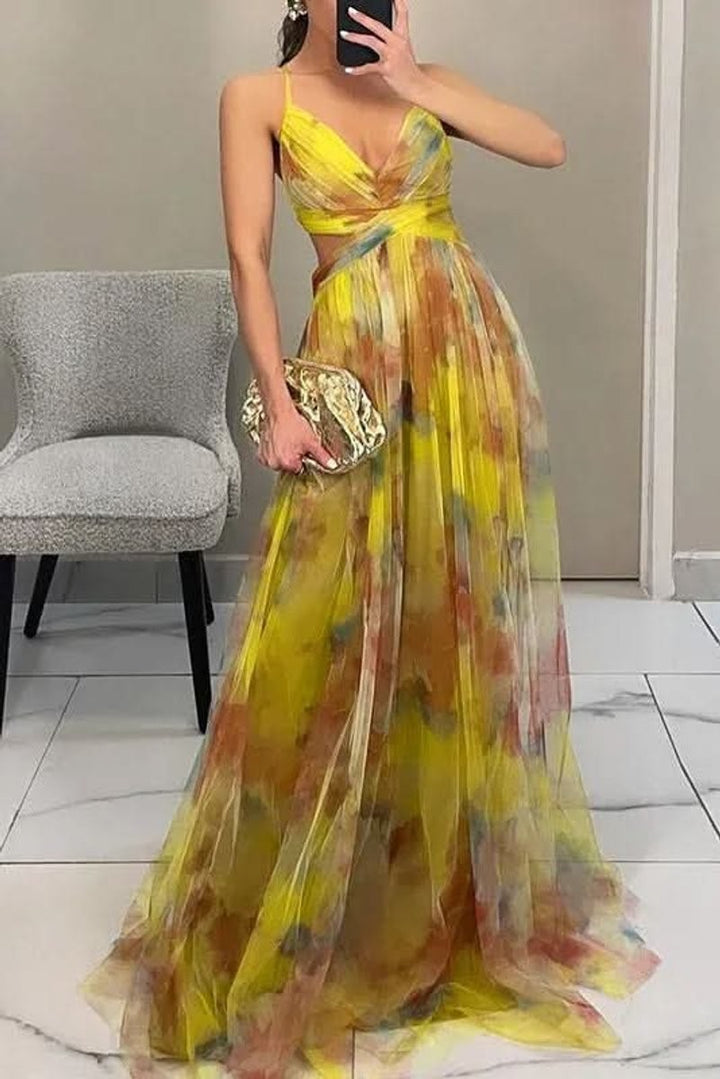Yellow watercolor floral maxi gown with crisscross bodice and thin straps