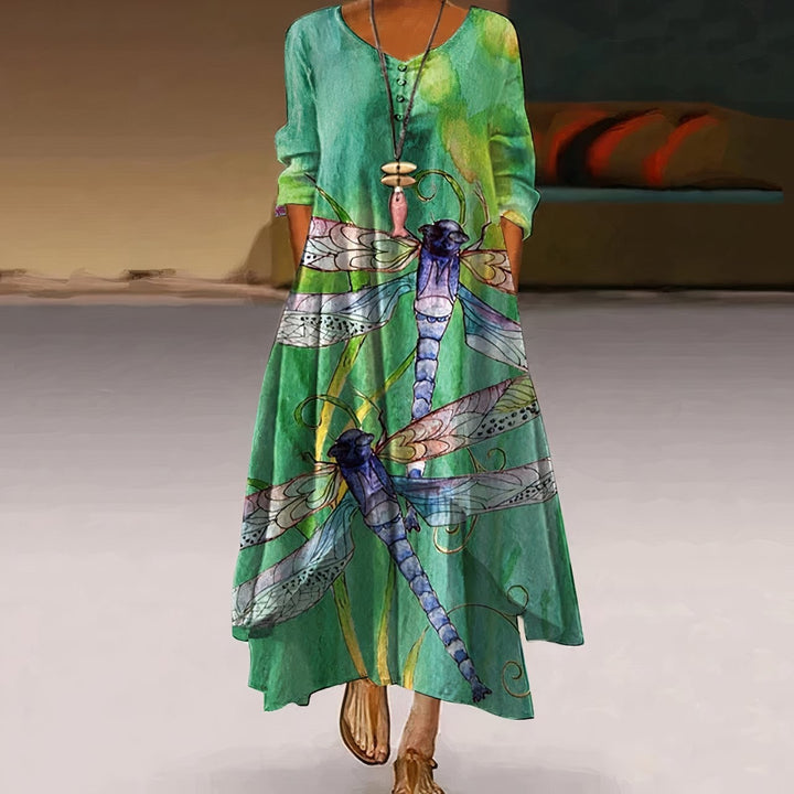 green maxi dress featuring dragonfly print and round neckline