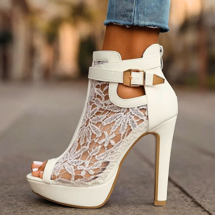 side view of white floral lace peep-toe ankle bootie heel