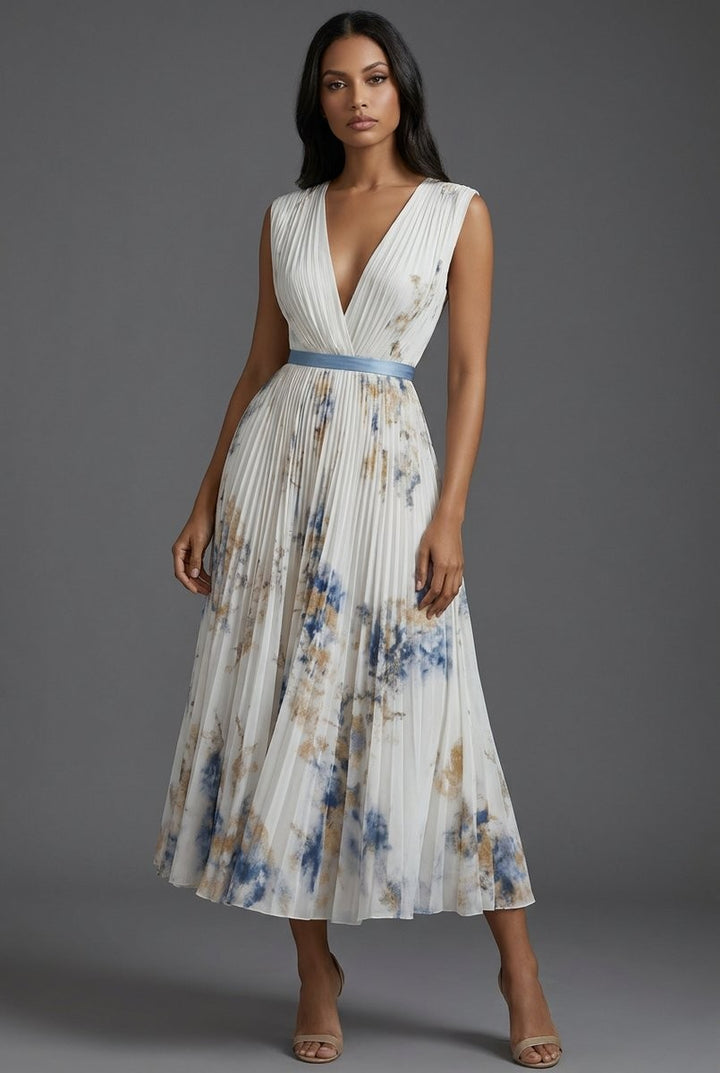 Front pose in cream pleated V-neck midi dress with floral accents