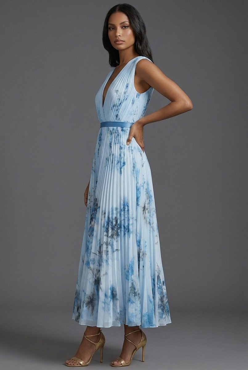 Side profile of blue pleated midi dress with tie-dye floral pattern