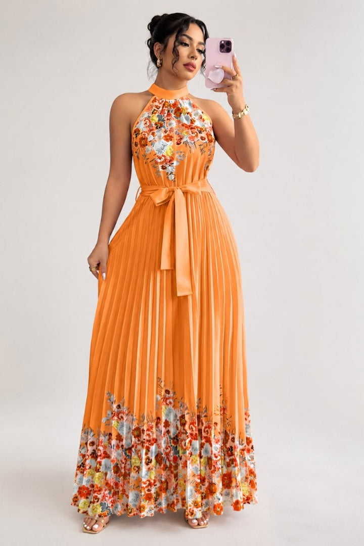 Orange floral pleated halter dress with flowy maxi skirt
