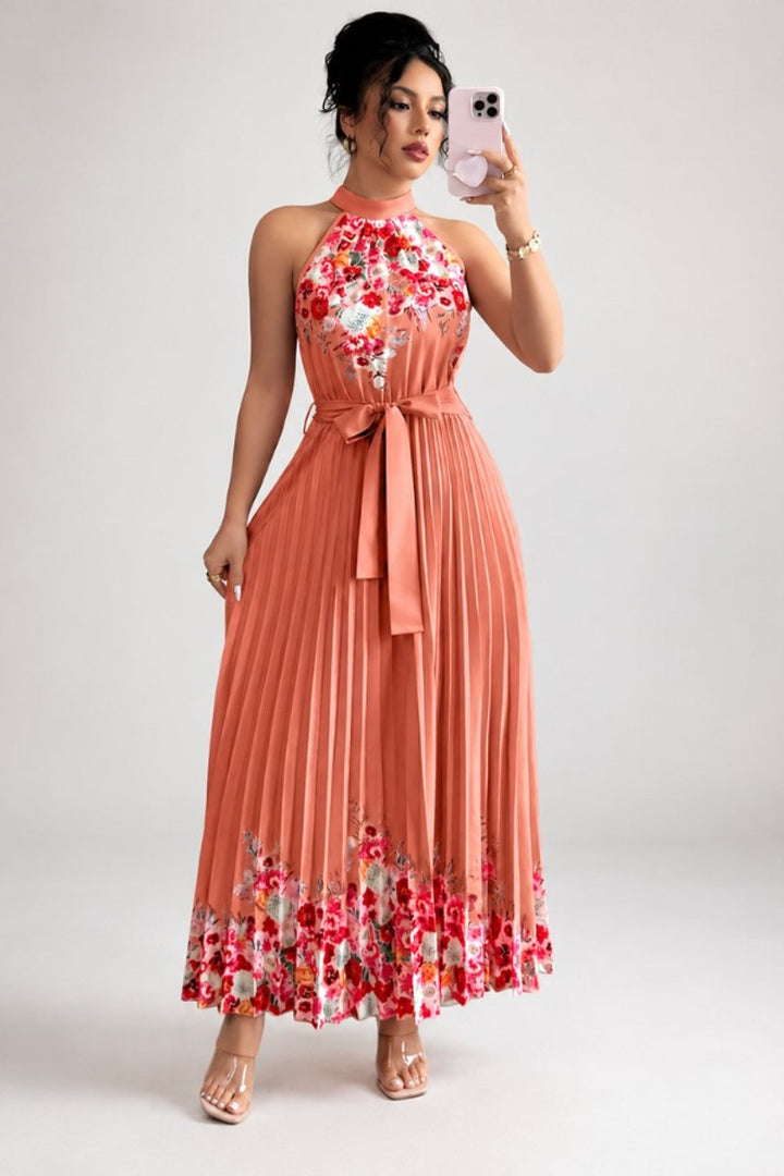 Coral floral pleated halter dress with tie waist and maxi length