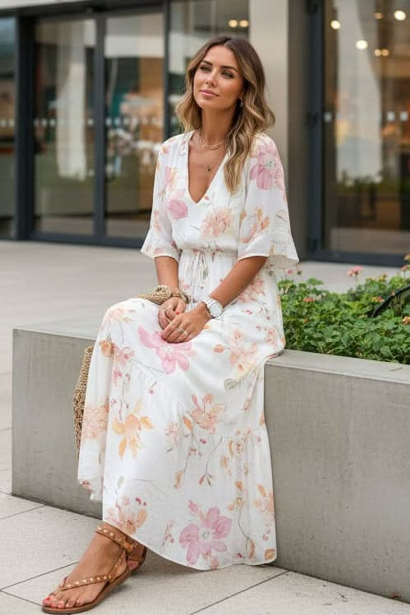 Bohemian floral maxi dress with cinched waist and flutter sleeve detail