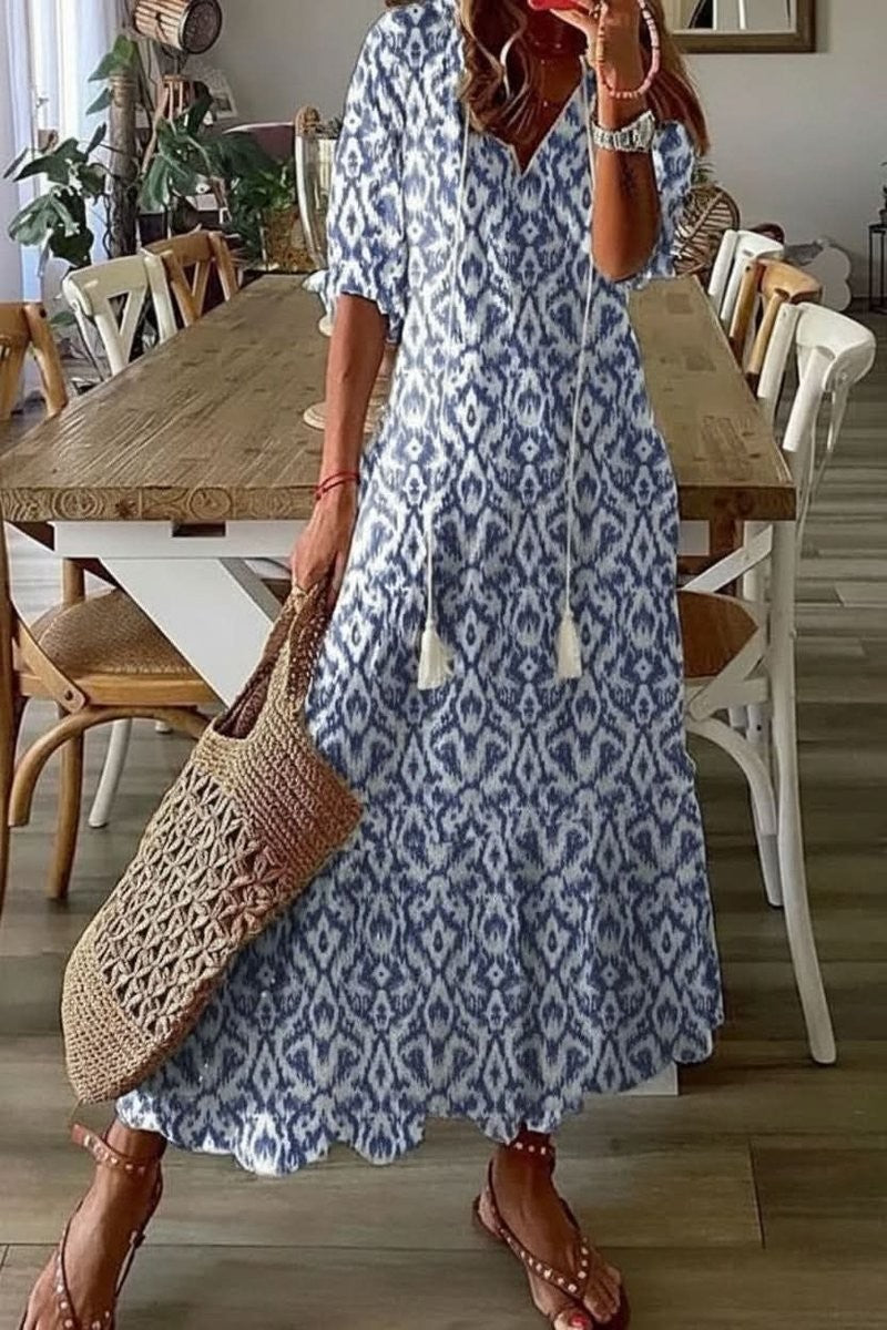 Blue ikat print V-neck maxi dress with tassel tie and flutter sleeves
