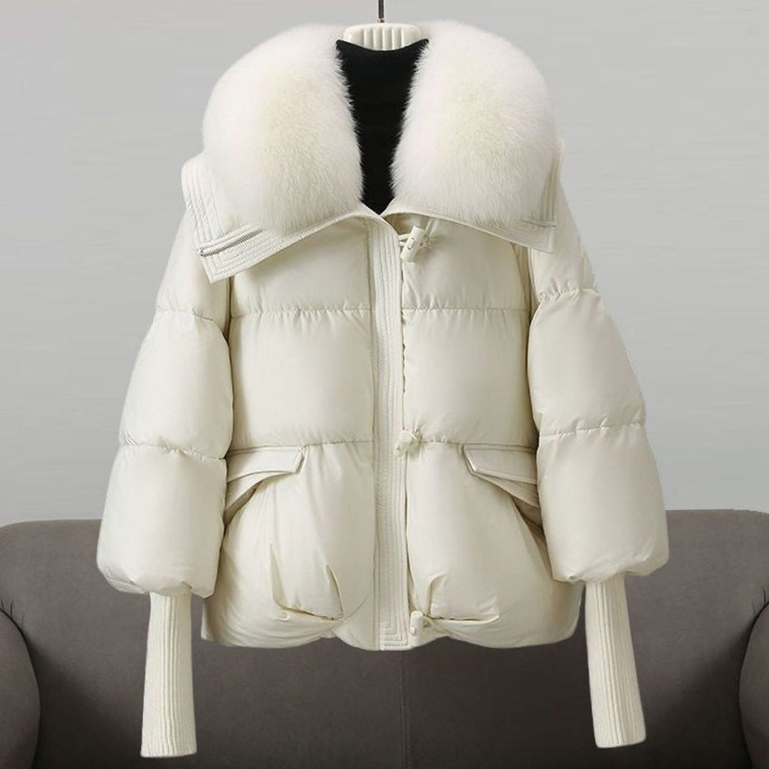 Cream puffer jacket featuring plush white fur collar detail