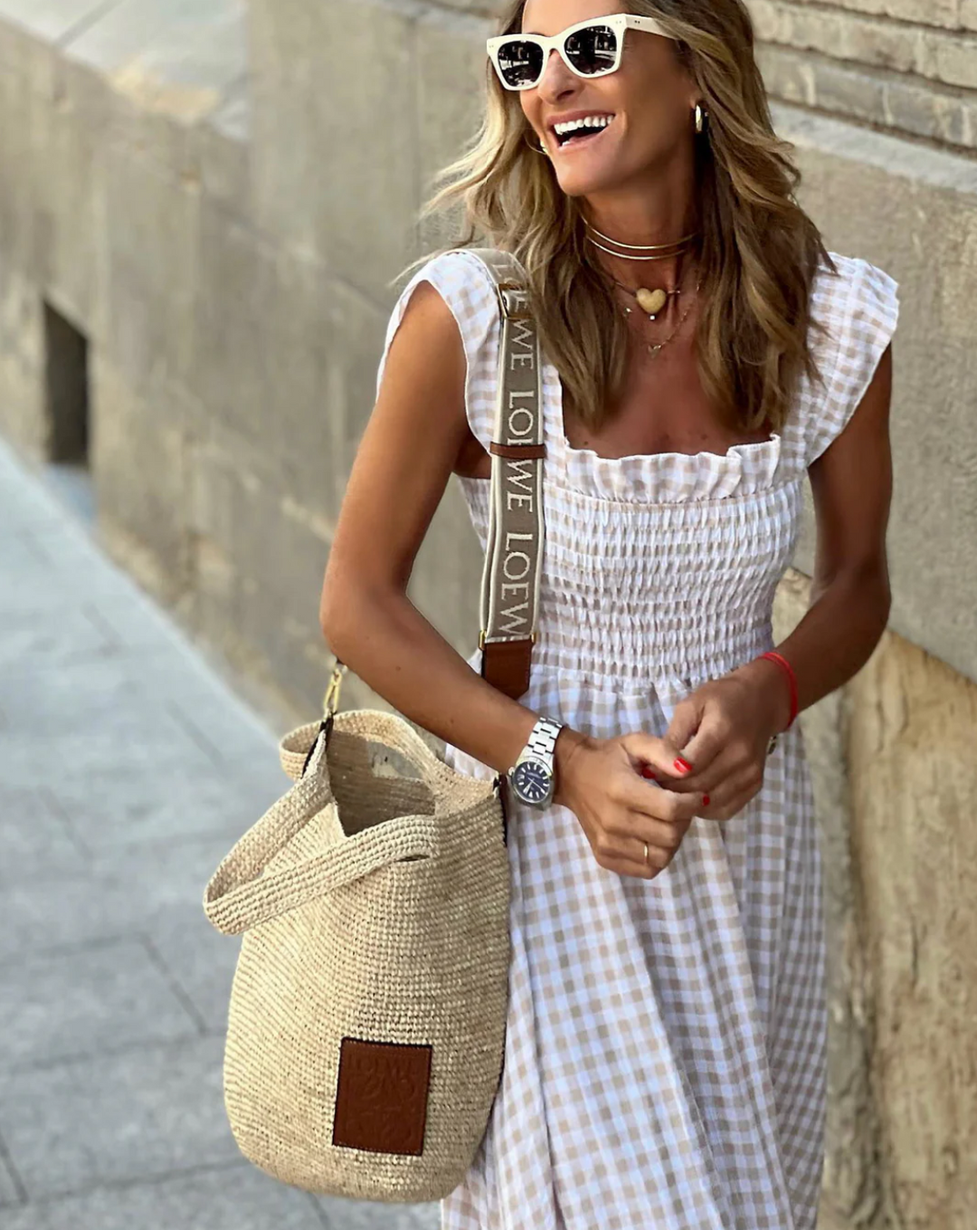 close-up of smocked bodice on beige gingham maxi dress with ruffled shoulder straps