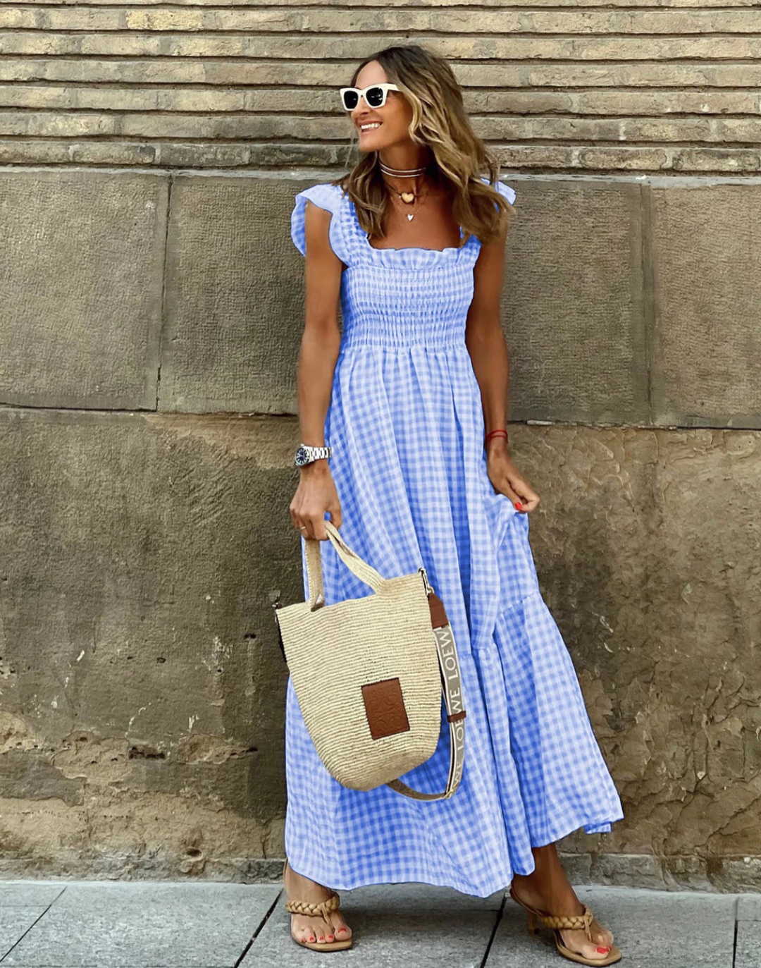 blue gingham smocked square neck maxi dress with ruffled sleeves and straw tote