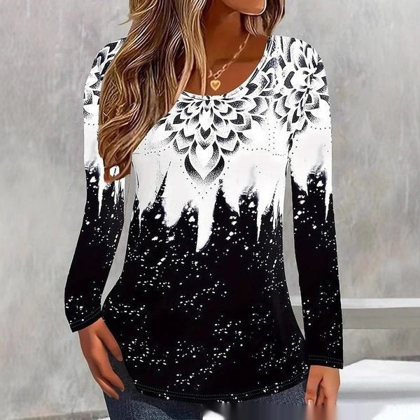 Black and white long-sleeve top with dripping floral mandala graphic