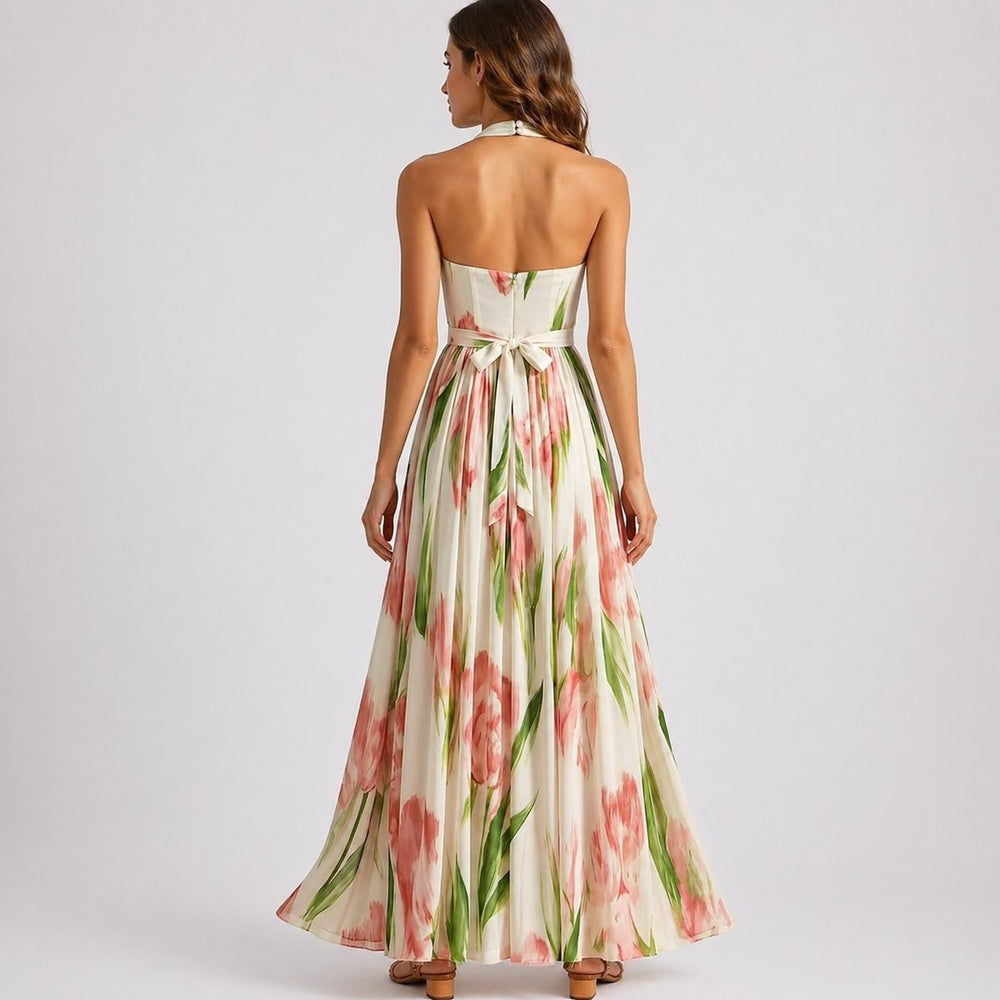 Backless halter maxi dress showing tie waist and floral print