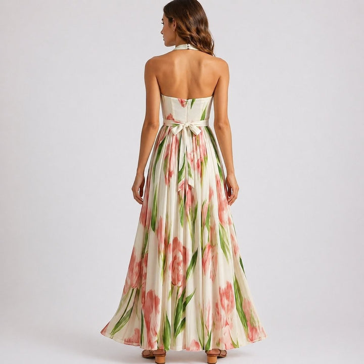 Backless halter maxi dress showing tie waist and floral print