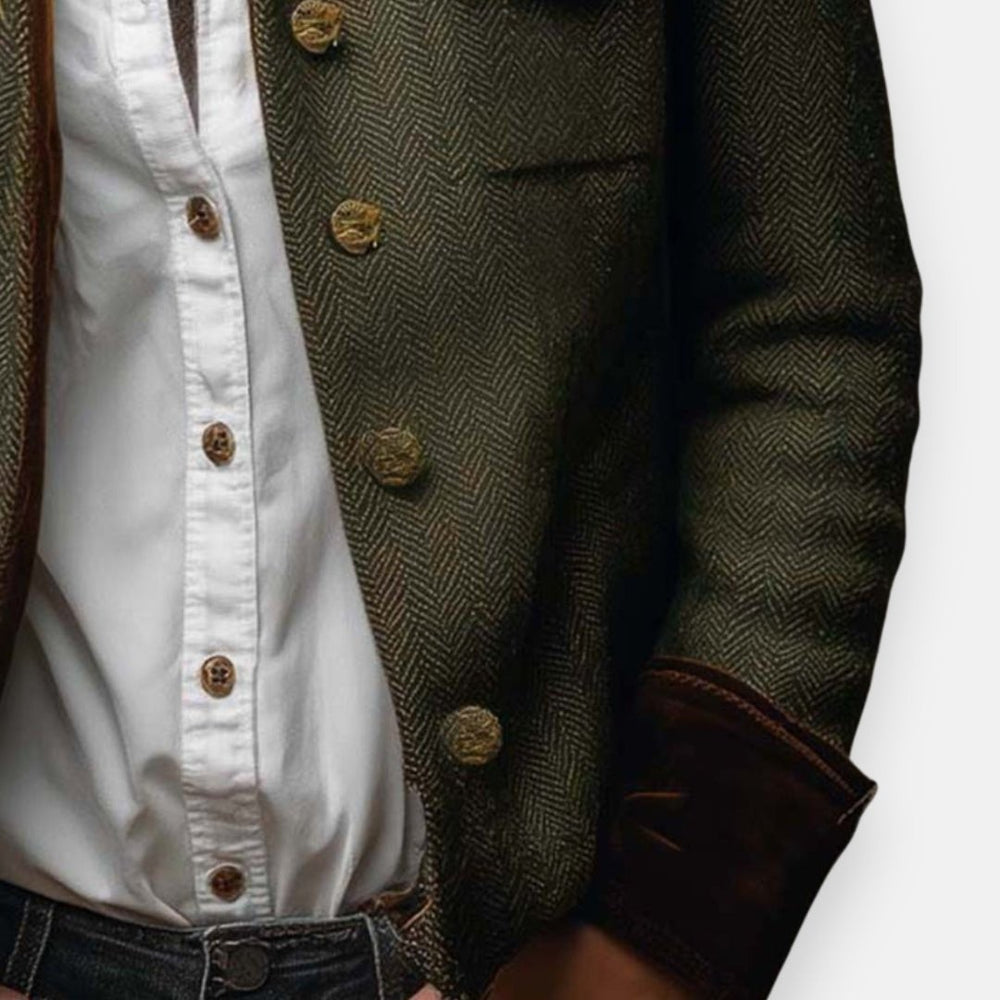 close-up of herringbone tweed blazer showing brass buttons and velvet cuff detail
