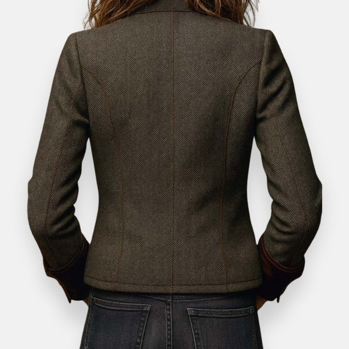 back view of olive herringbone blazer highlighting tailored seams and fitted cut