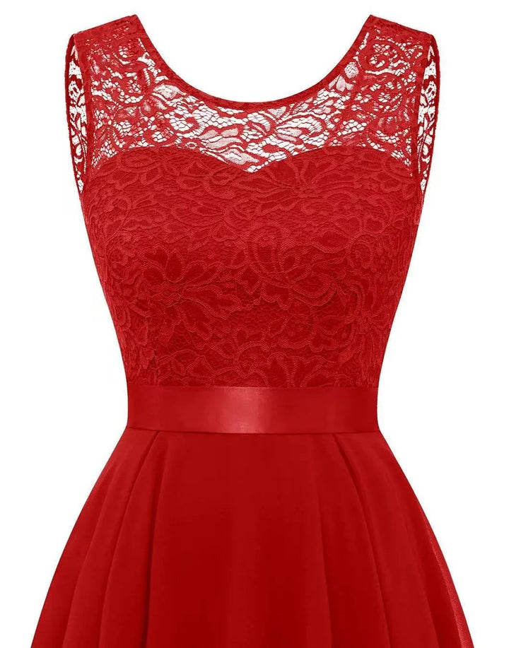 Front view of red lace top with sheer neckline and fitted waistband