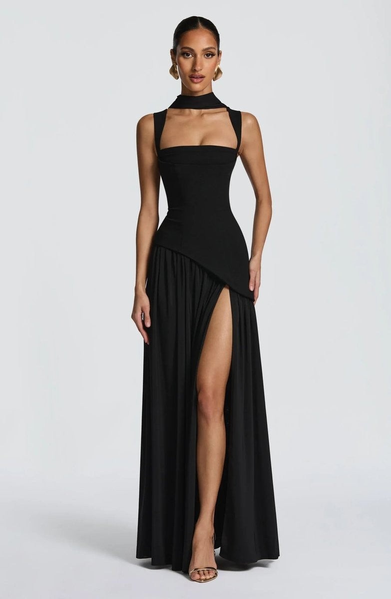 Black square-neck evening gown featuring cutout straps and dramatic leg slit