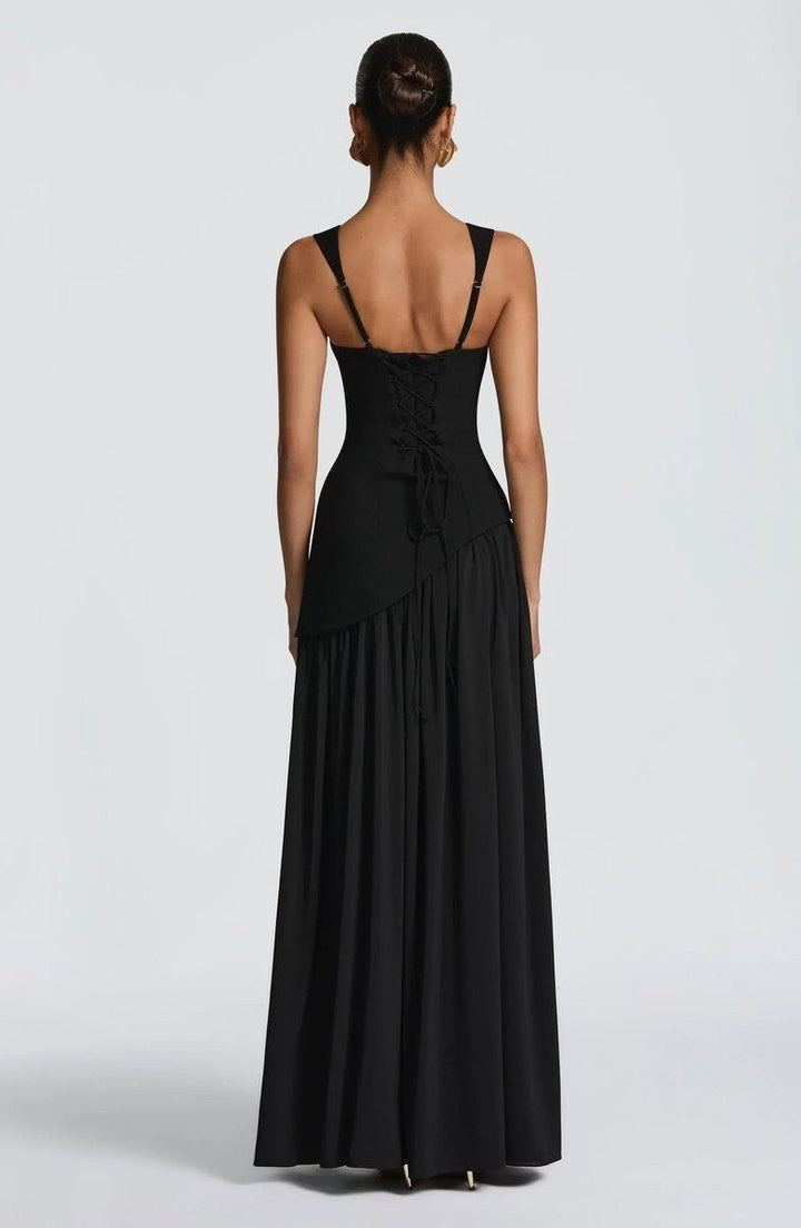 Black corset-back maxi dress with lace-up detail and flowing pleated skirt