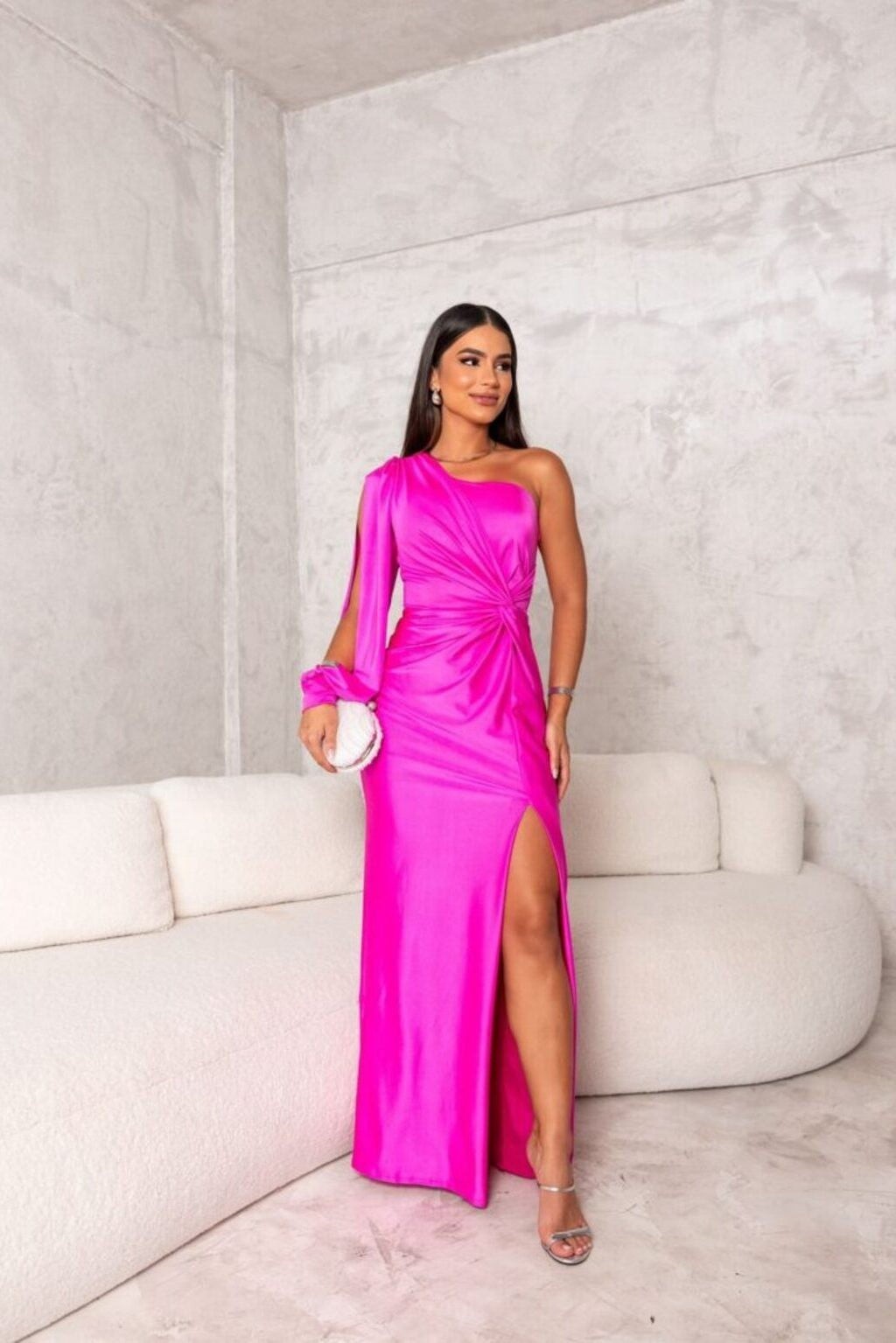 hot pink satin one-shoulder gown with draped sleeve and high slit