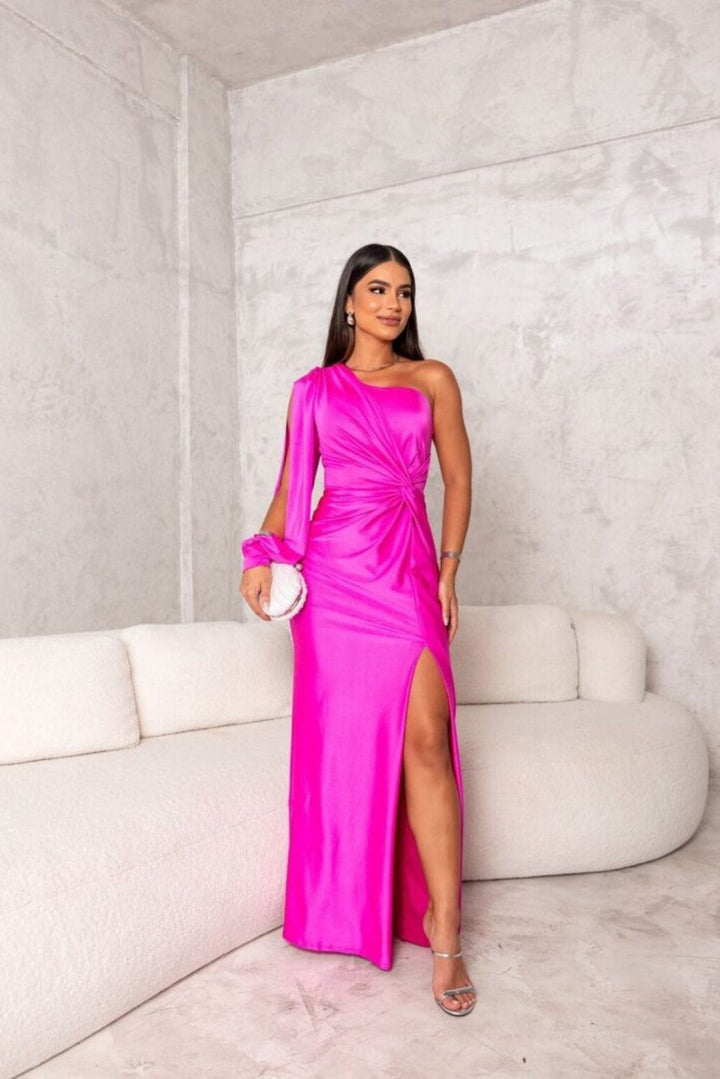 hot pink satin one-shoulder gown with draped sleeve and high slit