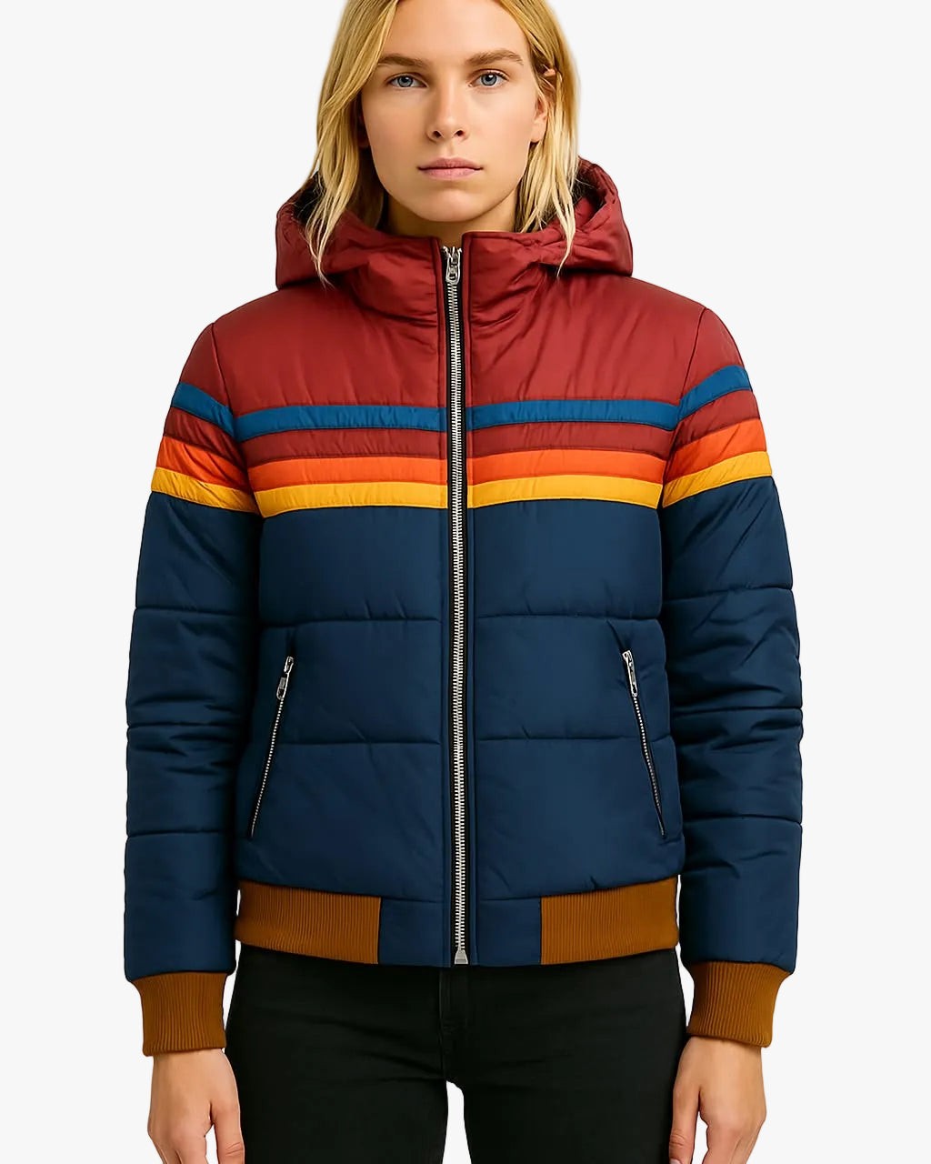 woman wearing navy puffer jacket with red hood and rainbow stripe detail
