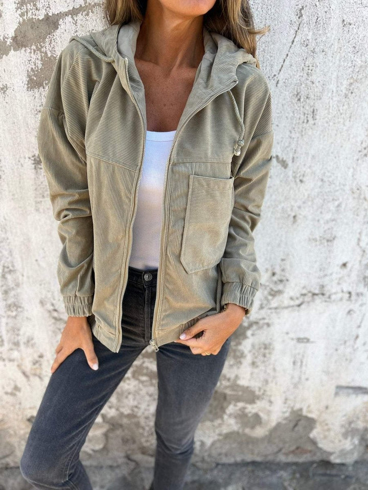 Olive green corduroy hooded zip-up jacket with front patch pocket, oversized style