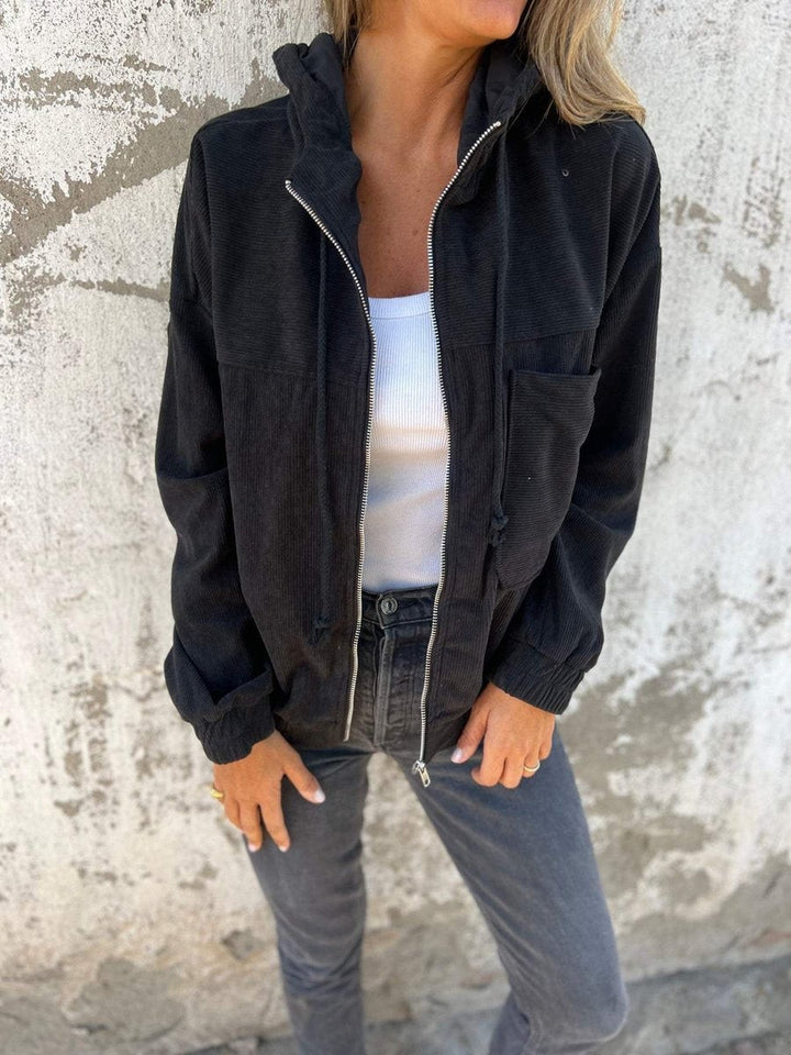 Black corduroy hooded zip-up jacket with quilted texture, oversized silhouette