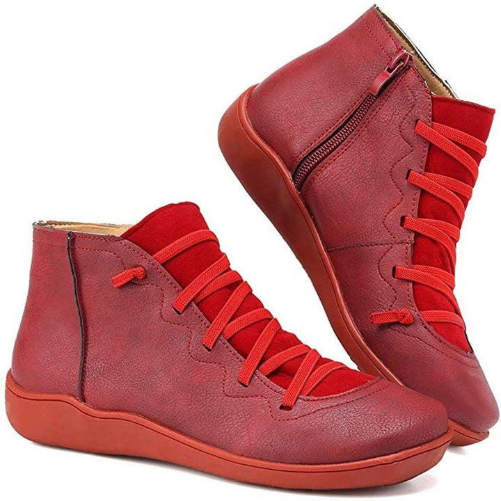 Red leather ankle boots featuring lace-up front and side zip closure