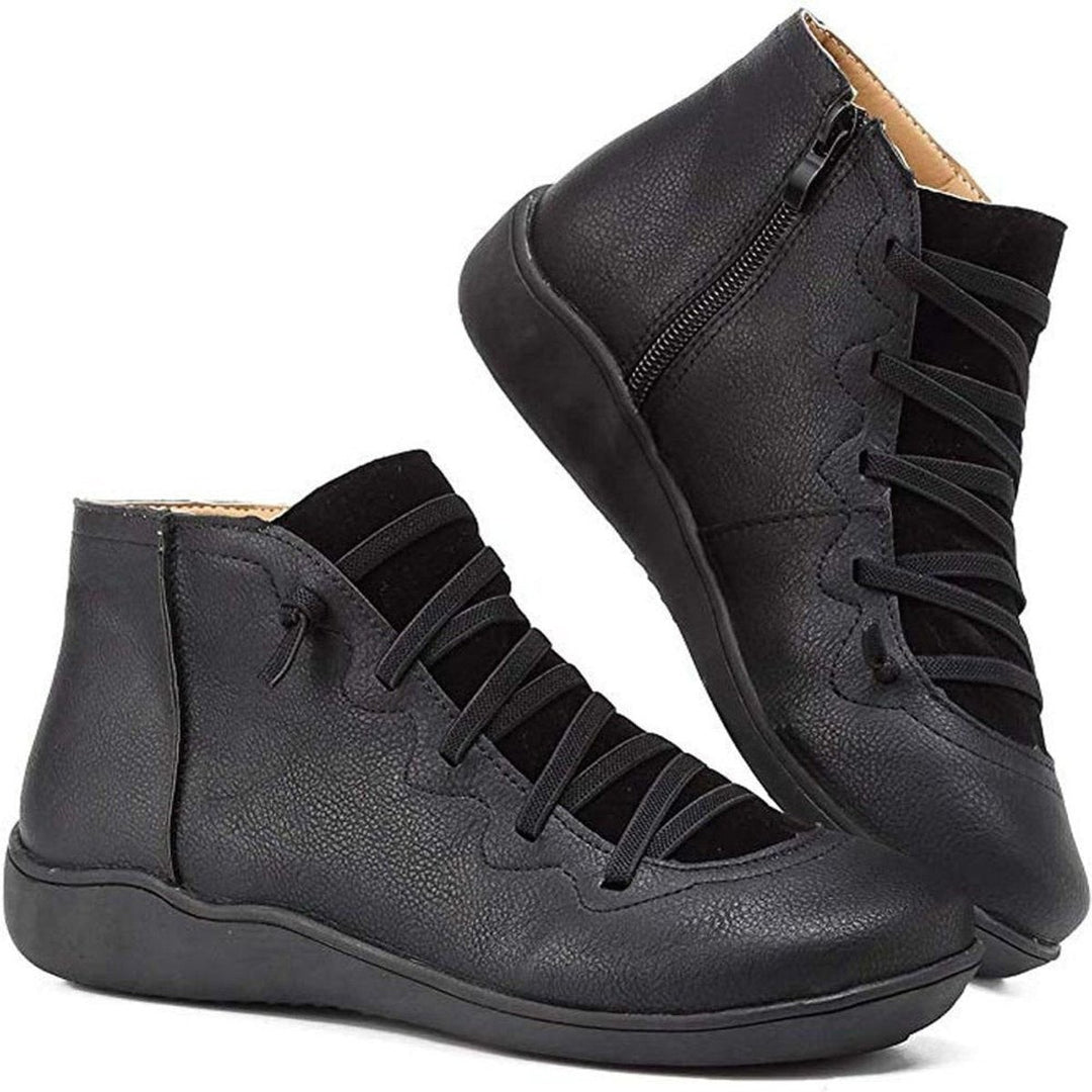 Black leather ankle boots with crisscross laces and flat sole