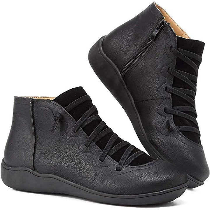 Black leather ankle boots with crisscross laces and flat sole