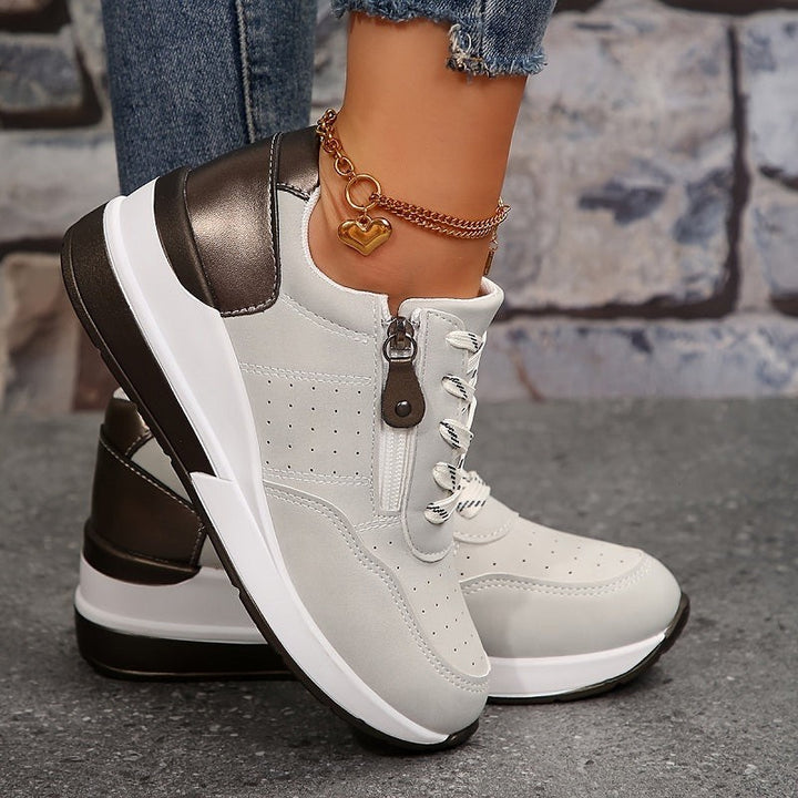 gray wedge sneakers with metallic zipper closure and chunky white sole