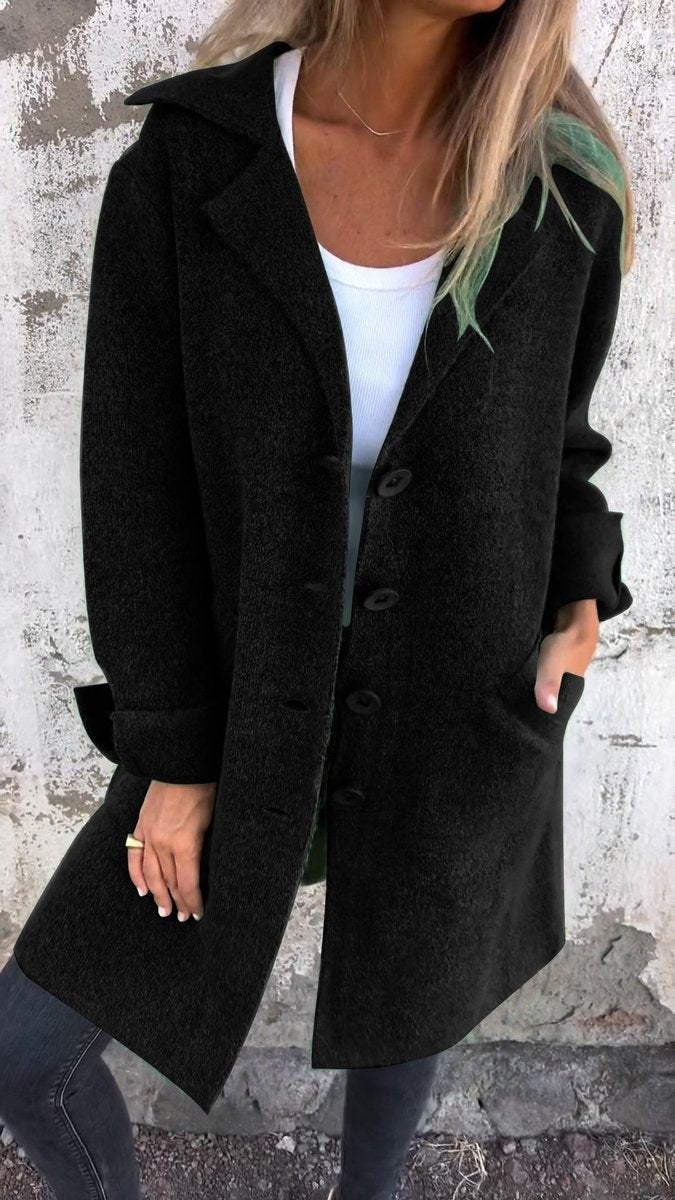 black relaxed-fit longline coat with lapel collar and front buttons