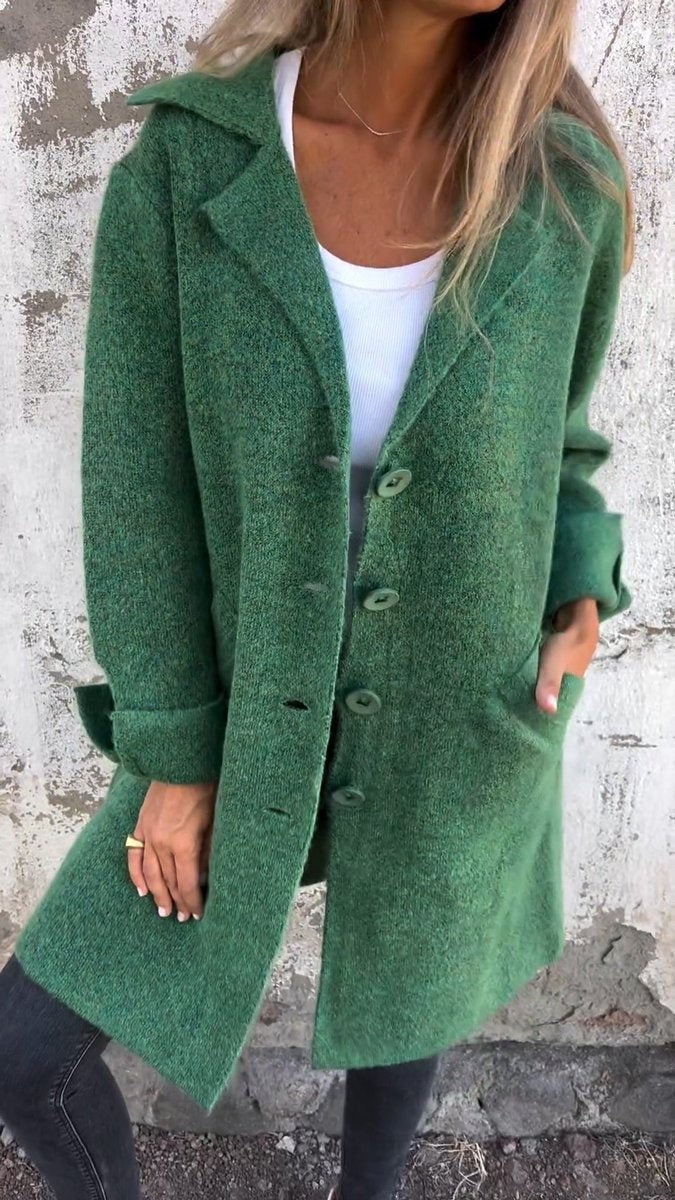 green longline button-up coat with lapel collar and side pockets