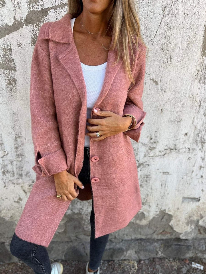 pink wool-blend longline coat paired with black skinny jeans
