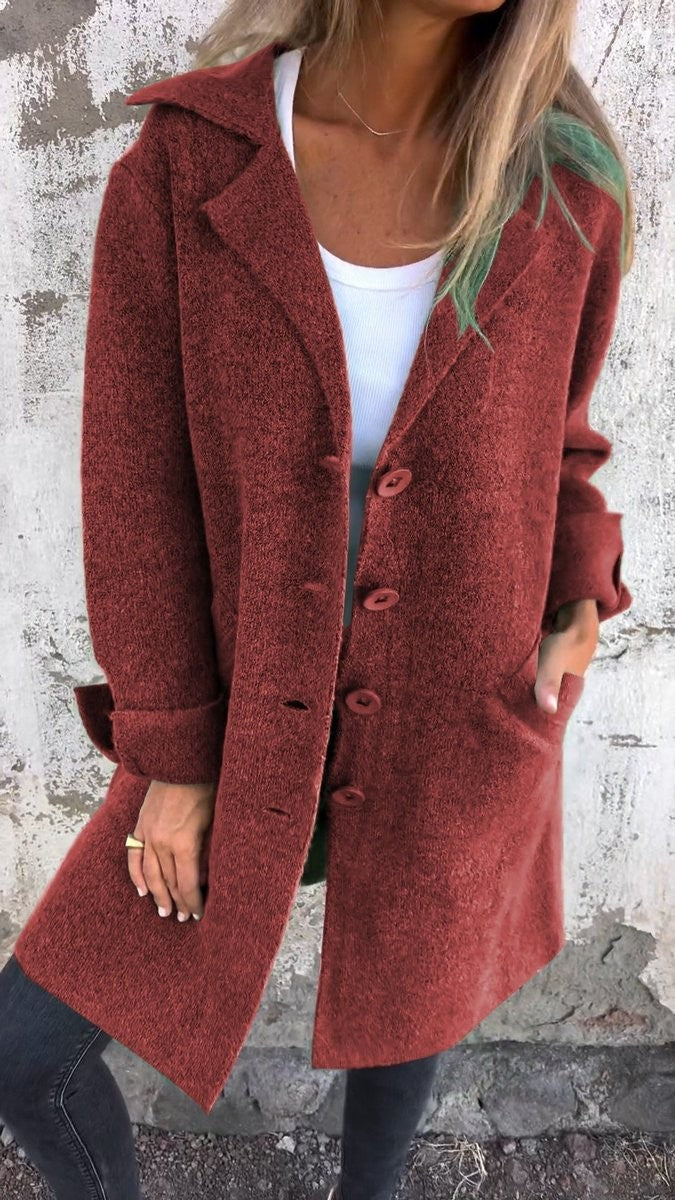rust red button-up longline coat with lapel collar and pockets