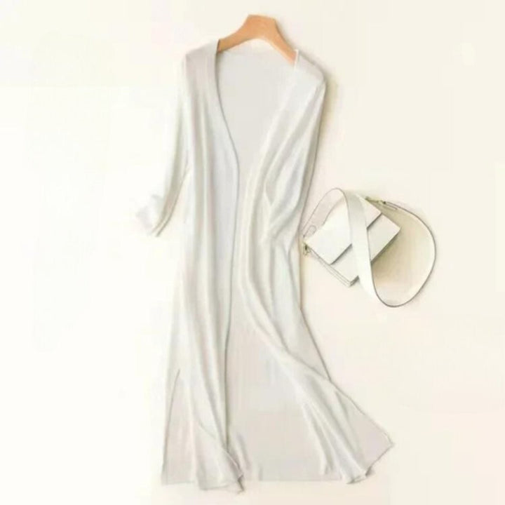 white lightweight long cardigan styled with matching handbag