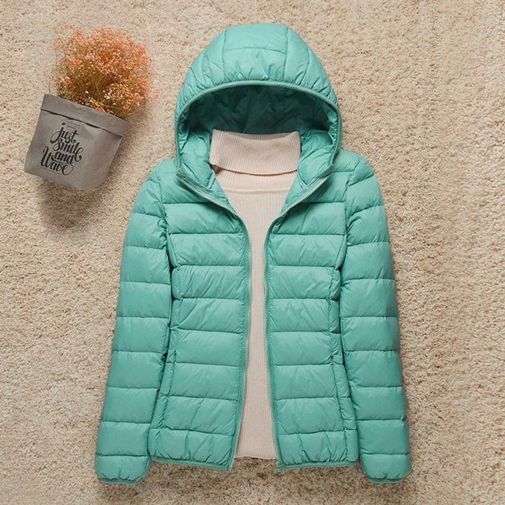 Mint green hooded quilted puffer jacket with packable down design