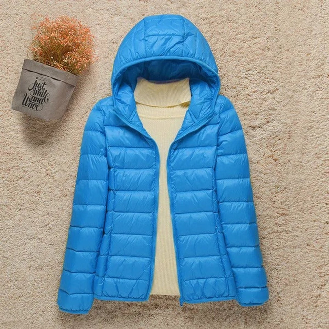 Bright blue hooded quilted puffer jacket with lightweight down fill
