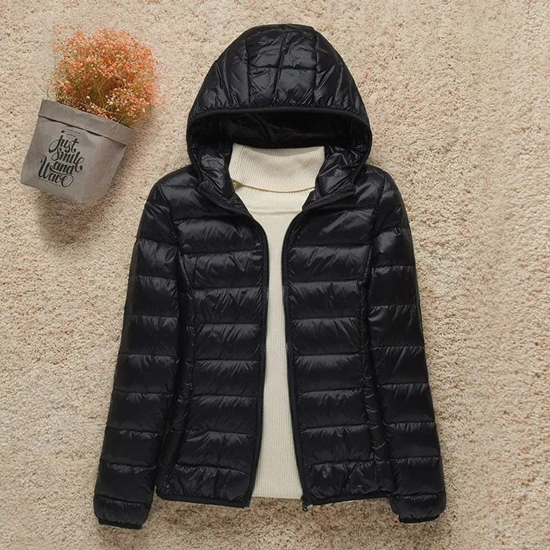Black hooded packable puffer jacket with shiny quilted finish
