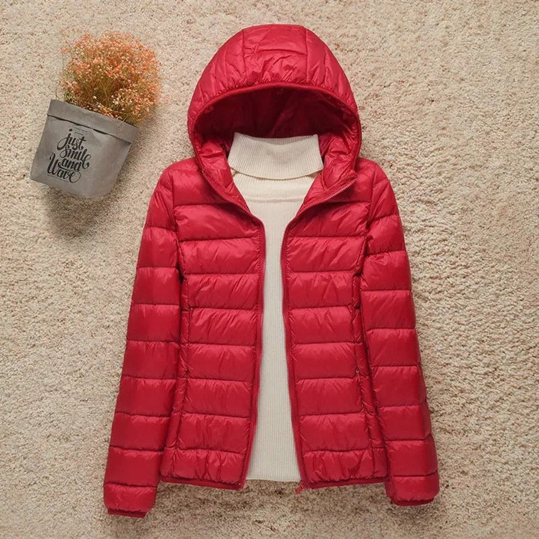 Bright red hooded lightweight puffer jacket with zip-up front