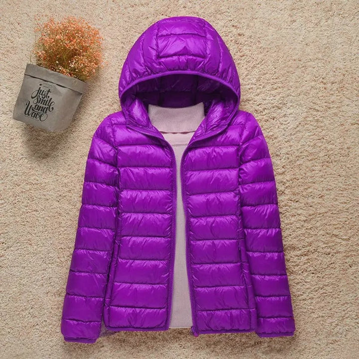 Purple lightweight hooded puffer jacket with glossy quilted texture