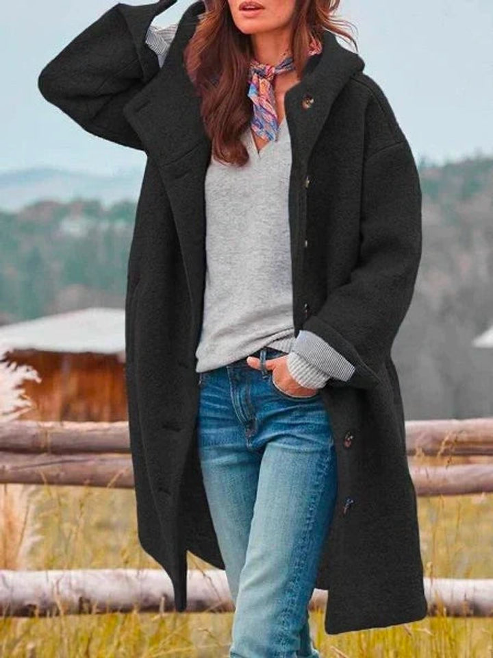 black hooded fleece coat with button closure, oversized long-line silhouette