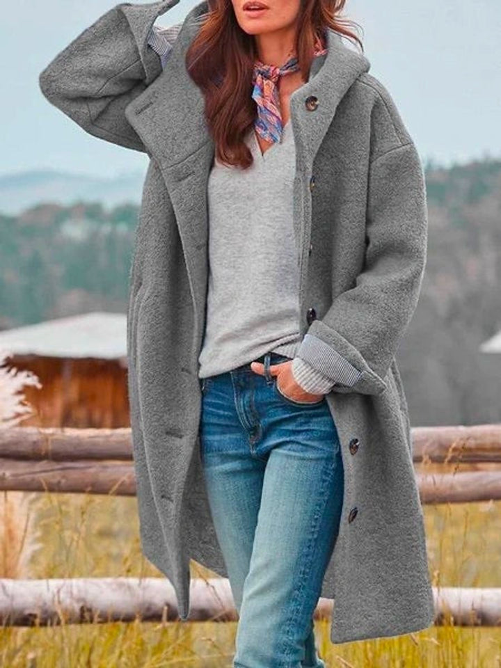 gray hooded fleece coat, button-up front paired with jeans outdoors