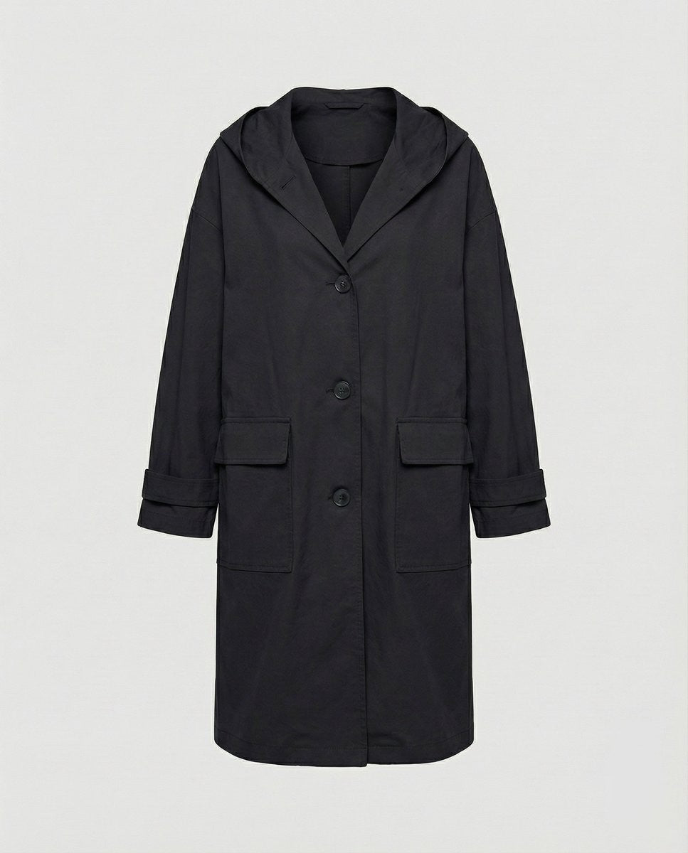 Black long hooded trench coat with patch pockets, laid flat