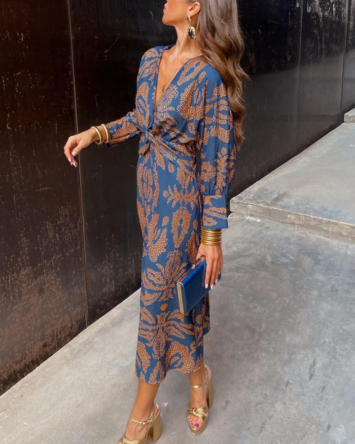 Navy and gold paisley midi dress with twist-front detail and long sleeves