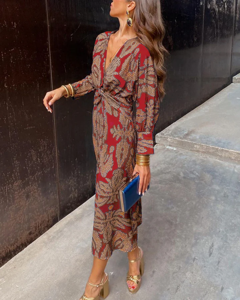 Red and gold paisley midi dress with twist-front waist and long sleeves
