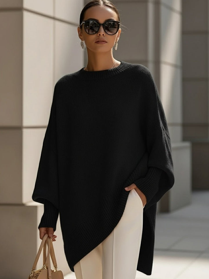 Black oversized longline sweater with batwing sleeves and ribbed hem detail