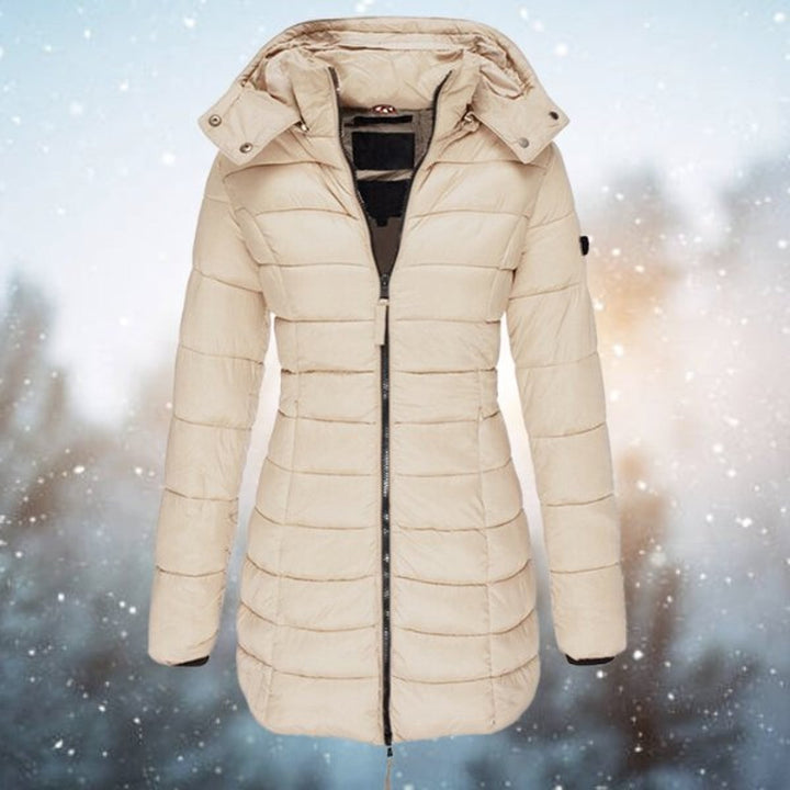 Beige quilted hooded jacket with long silhouette and ribbed sleeve cuffs