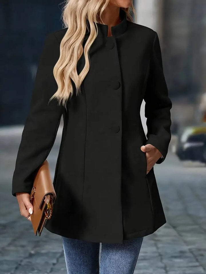 black longline coat blazer with stand collar, paired with denim jeans