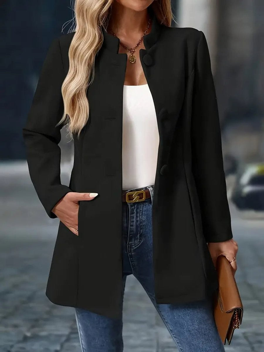 black stand-collar longline coat blazer paired with white tank top